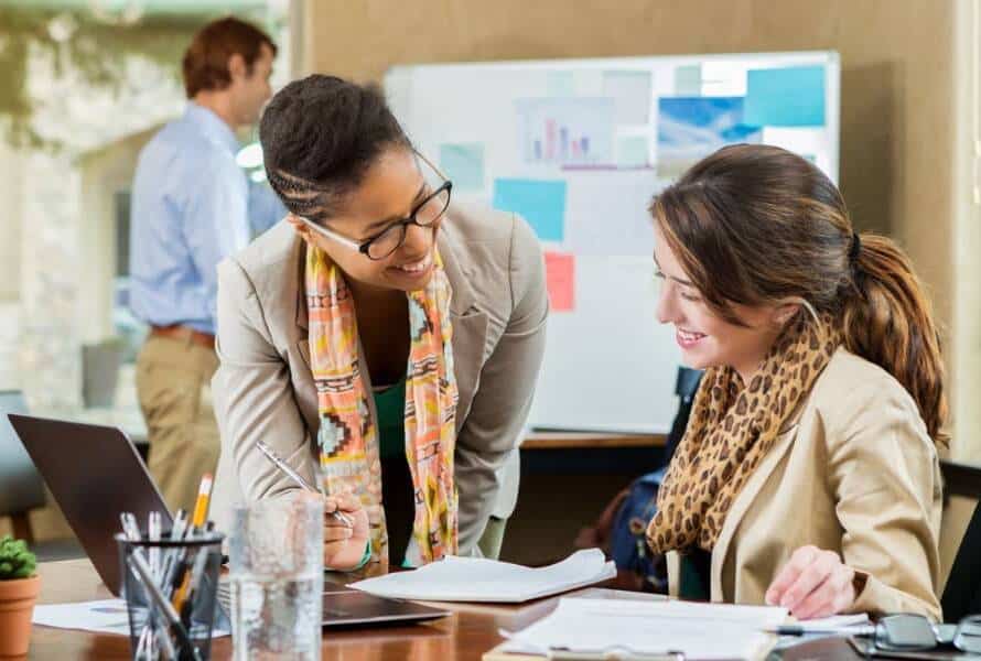 A business owner meets with her chief of staff