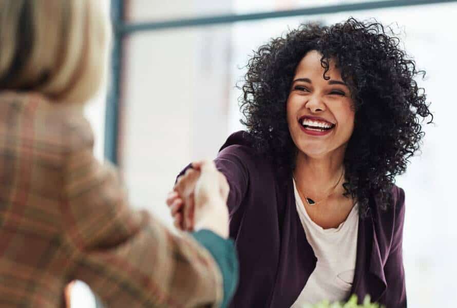 two businesswomen shaking hands