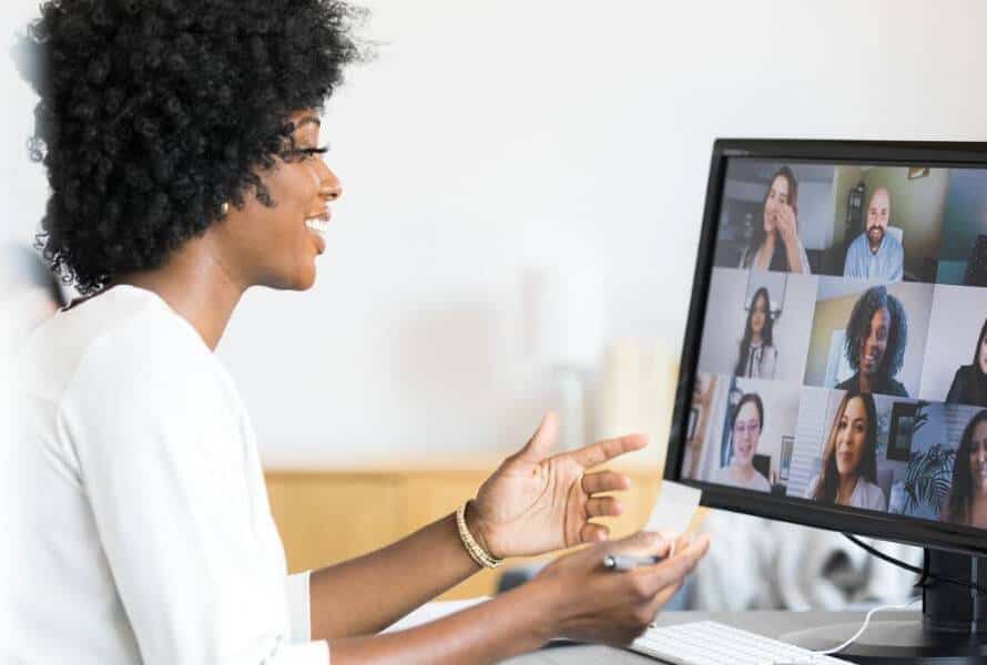 A chief of staff talks with a remote team